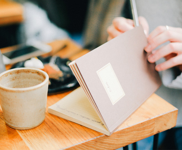 How To Do A Wedding Budget Right Wedding Budget - Writing In Notebook