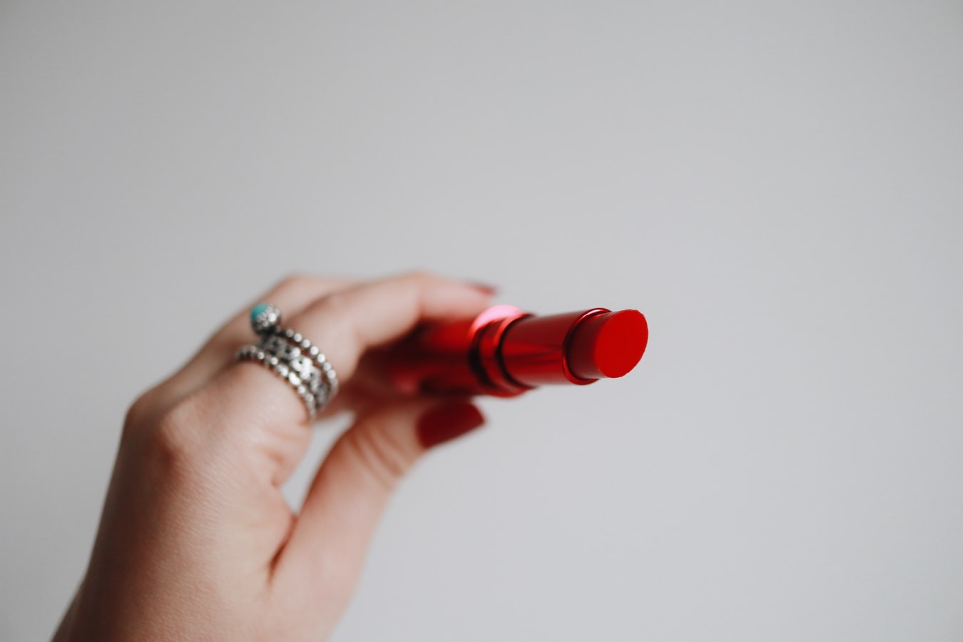 Wedding Day Emergency Kit - Female Hand Holding Red Lip Balm