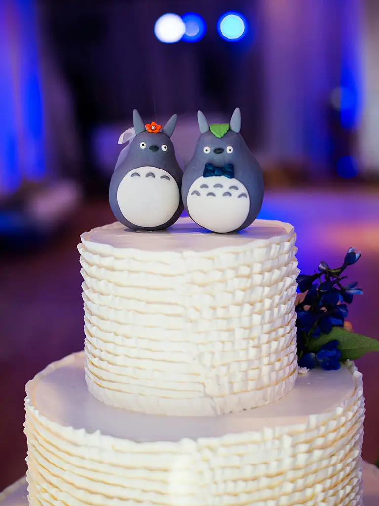 Penguin Wedding Cake Toppers On White Textured Cake