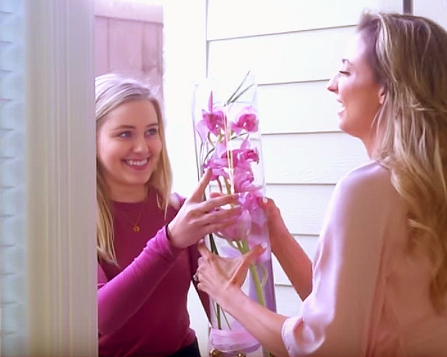 Wedding Hacks To Save You Money And Stress Wedding Hacks - Two Women Exchanging A Vase