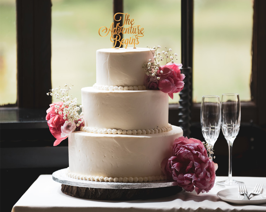 Wedding Hacks To Save You Money And Stress Wedding Hacks - Wedding Cake With Champagne Glasses