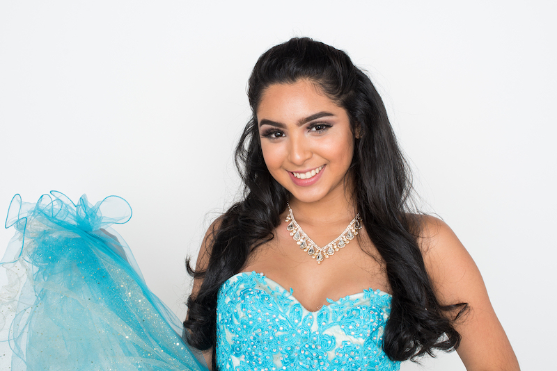 Young Women In Baby Blue Quinceanera Dress.