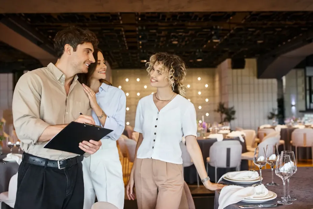 All-Inclusive Venues: What They Really Offer and Why Couples Choose Them Couple reviewing event details with coordinator while touring one of the all-inclusive venues for weddings